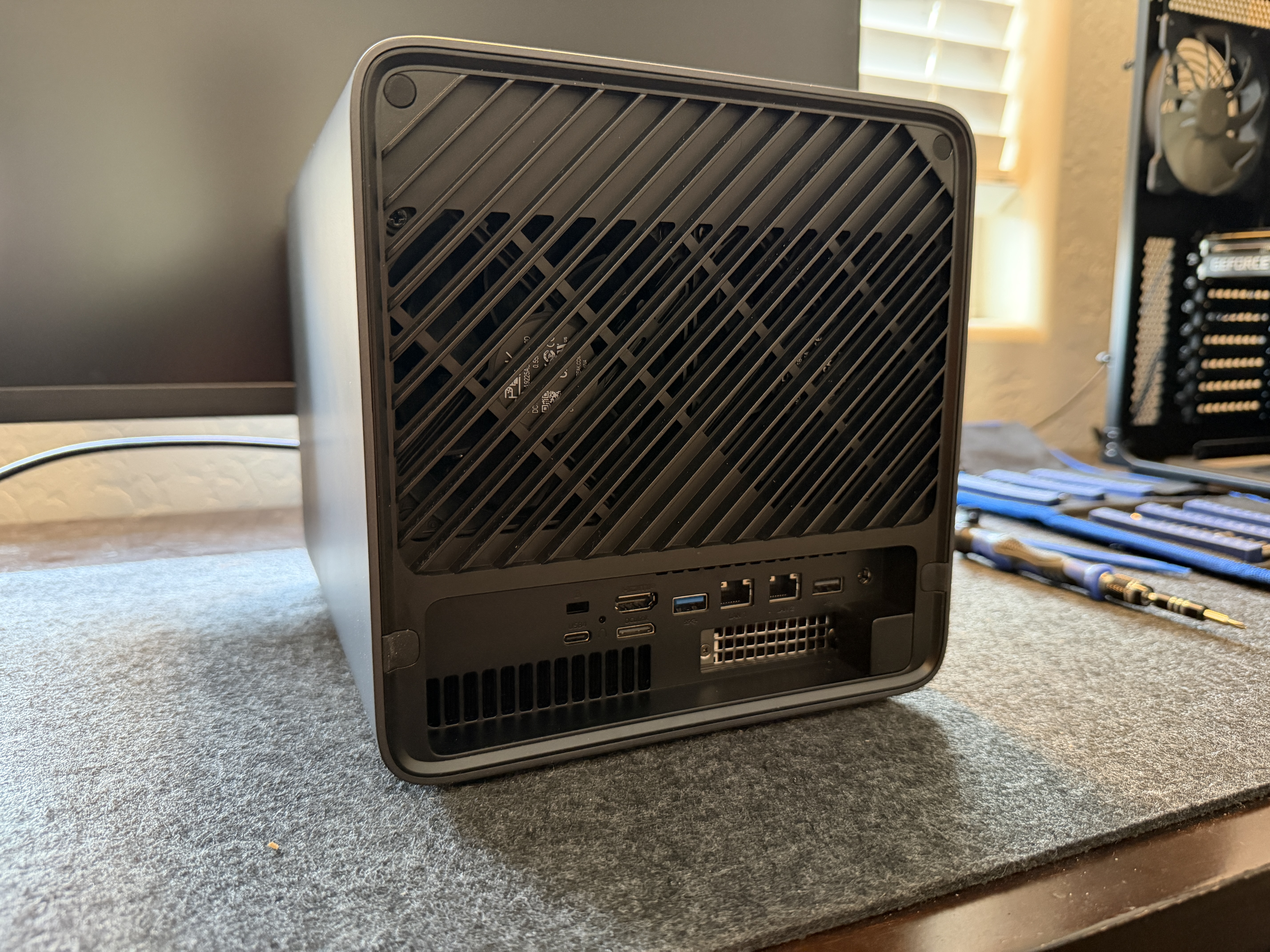 Minisforum N5 Air rear panel showing fan grille, all I/O ports, and PCIe slot bracket
